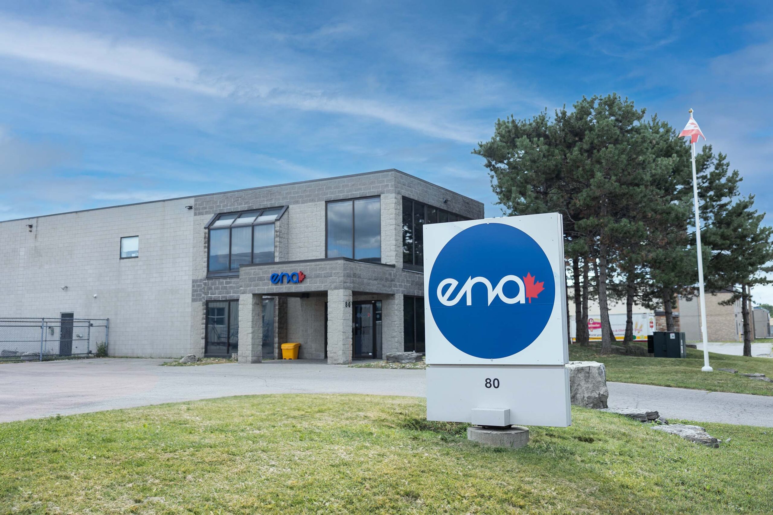 The full view of ENA with the larger sign on the front lawn
